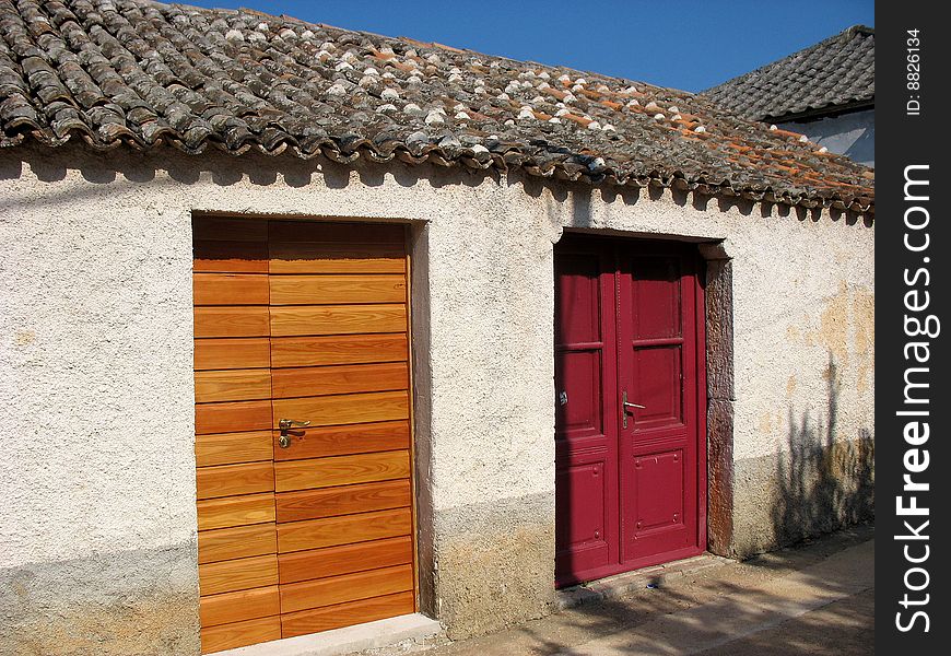 Old house with two different wooden doors