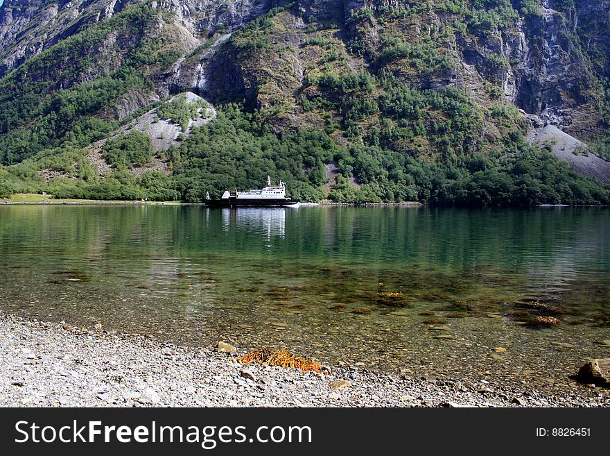Small ferry in the scenic Norwegian Fjord. Small ferry in the scenic Norwegian Fjord