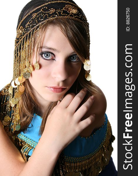 Beautiful young teenager posing in a belly dance costume. Beautiful young teenager posing in a belly dance costume