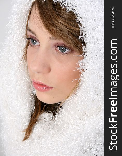 Beautiful young teenager wearing warm winter scarf. Beautiful young teenager wearing warm winter scarf