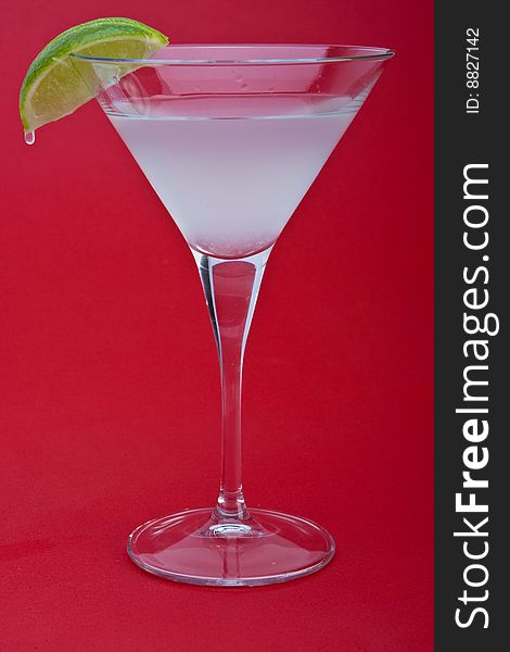 Kamikazi cocktail over a red background