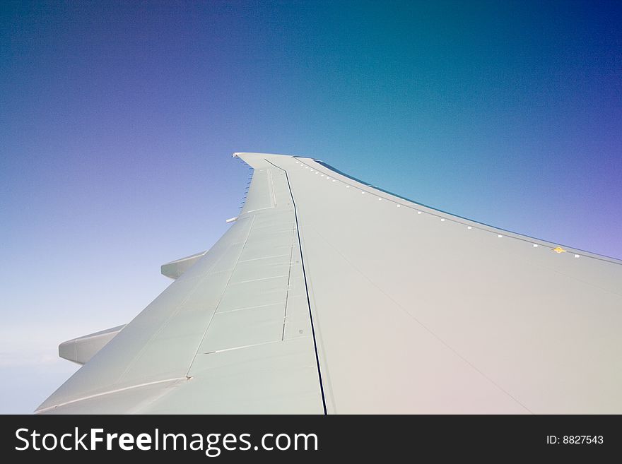 The view out the window of an airplane wing