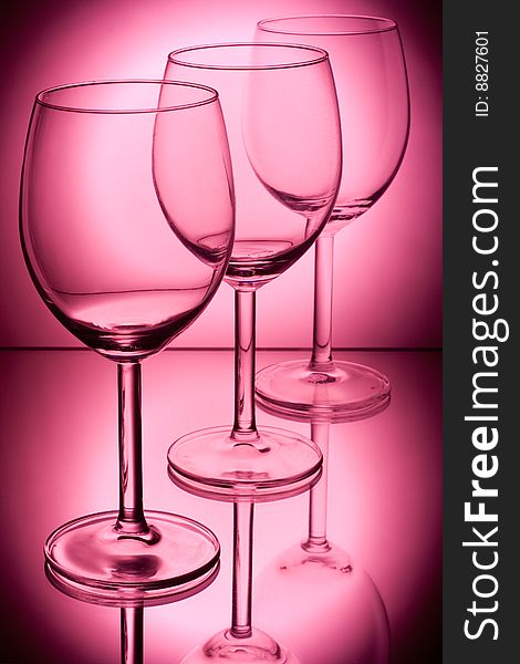 Wine glasses on a red background