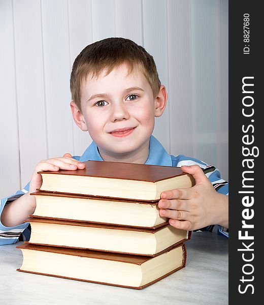 The child with books on the white