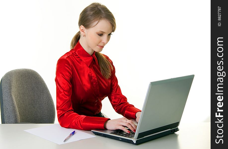 Young woman with laptop working at office