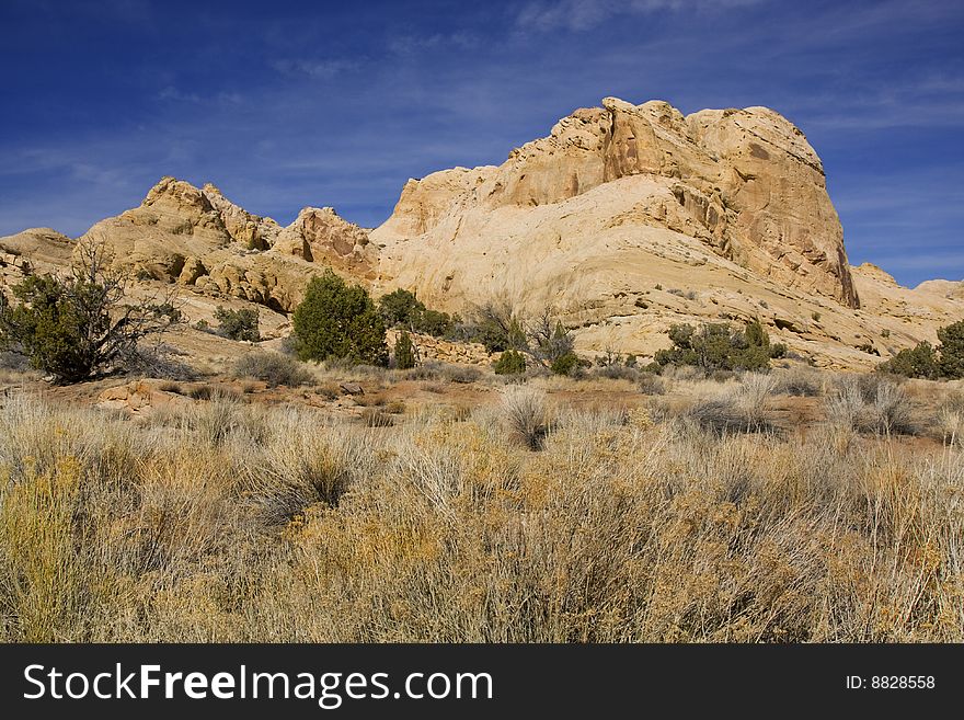View of red rock formations in San Rafael Swell with blue sky�s the and clouds