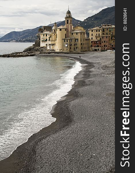 Church and beach Camogli, a small tourist town in liguria