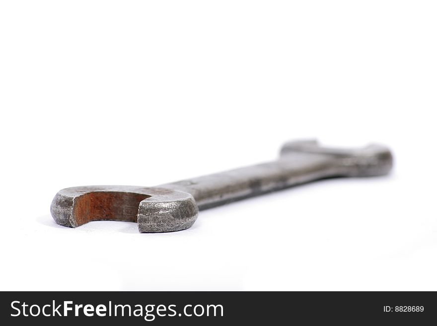 Old used spanner on a white background. Old used spanner on a white background.