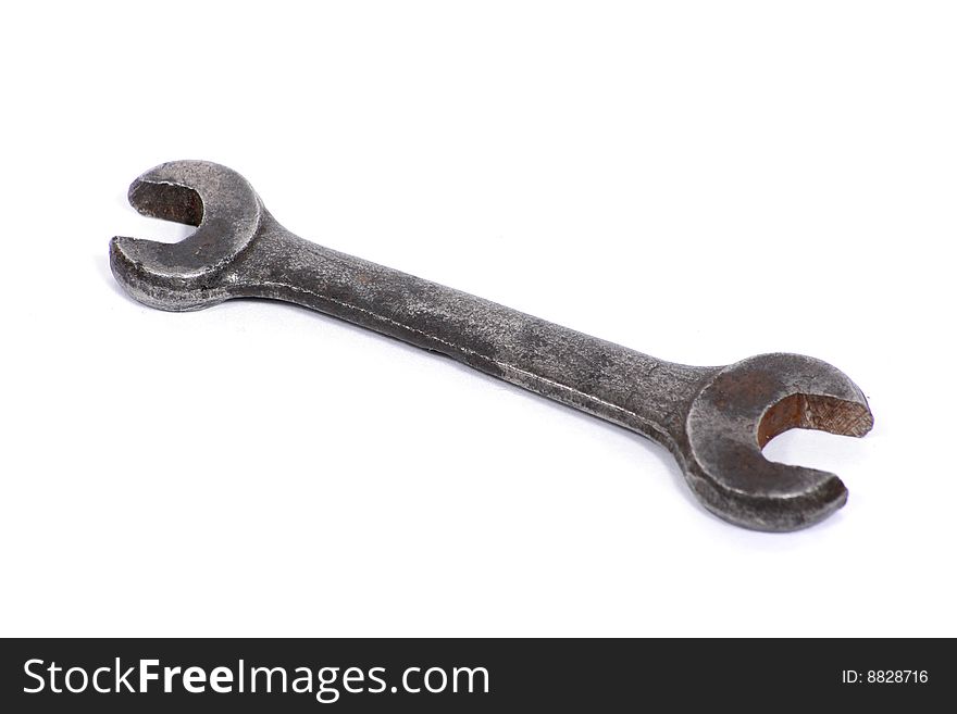 Old used spanner on a white background. Old used spanner on a white background.