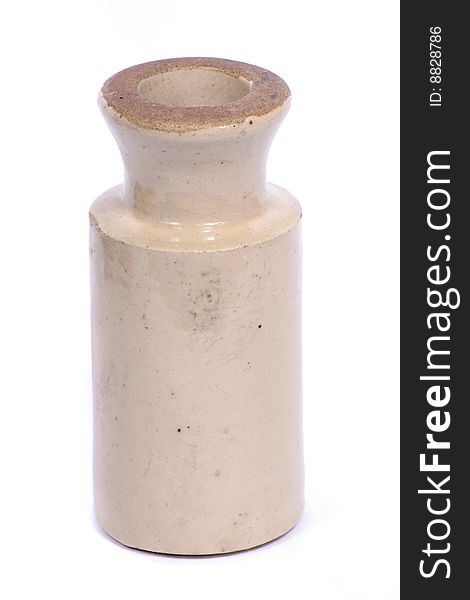 A old pottery container on a white background. A old pottery container on a white background.