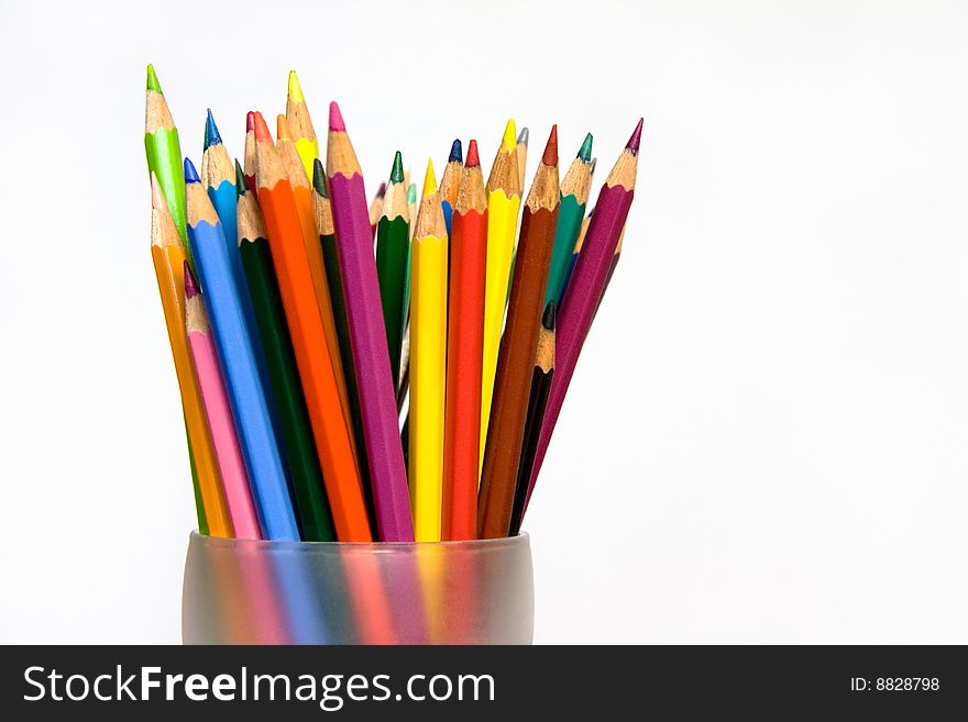 Assorted Colored Pencils in Glass