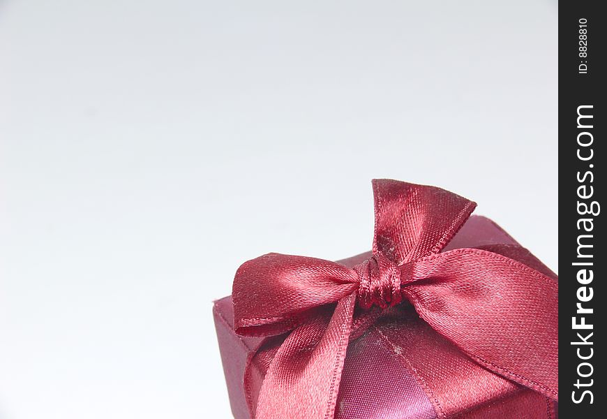 Red gift box with red ribbon