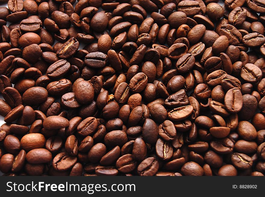 The top view on a background from coffee grains. The top view on a background from coffee grains