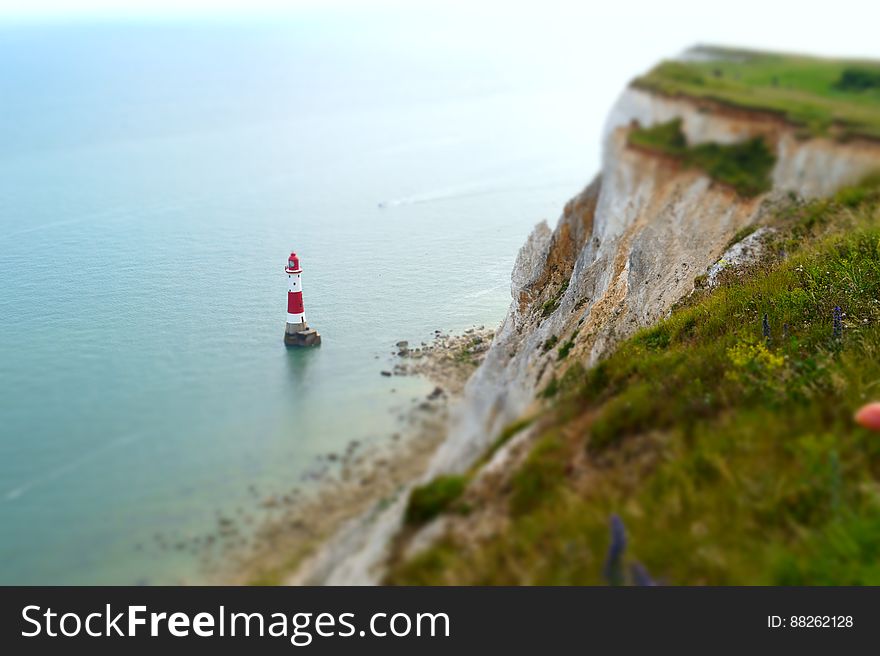 Ocean Lighthouse By Cliffside