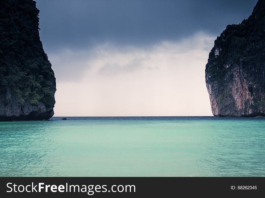 Ocean Water Between Two Cliffs