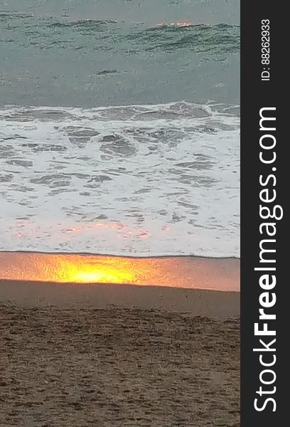 Caught the reflection of the sunset in the sand. Caught the reflection of the sunset in the sand.