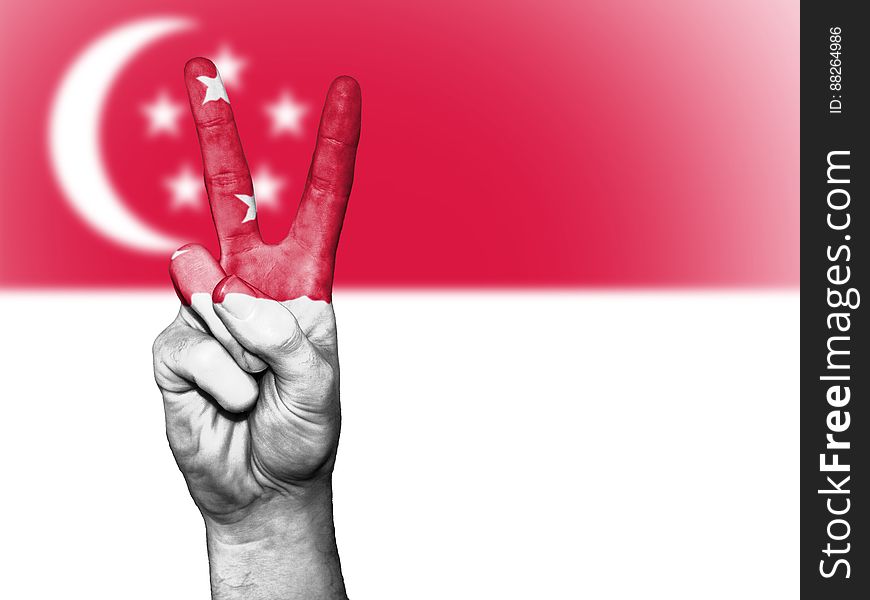 Illustration of hand gesturing peace against Singapore flag. Illustration of hand gesturing peace against Singapore flag.