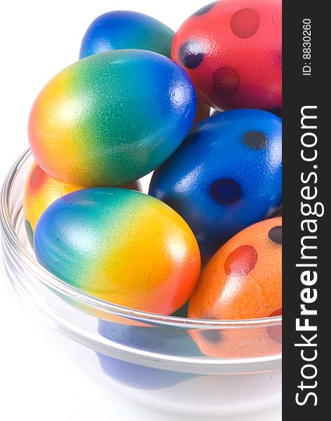 Easter eggs in bowl of glass, isolated on white. Easter eggs in bowl of glass, isolated on white.