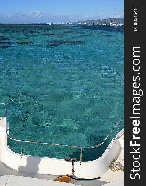 Boat on a turquoise lagoon in polynesia. Boat on a turquoise lagoon in polynesia