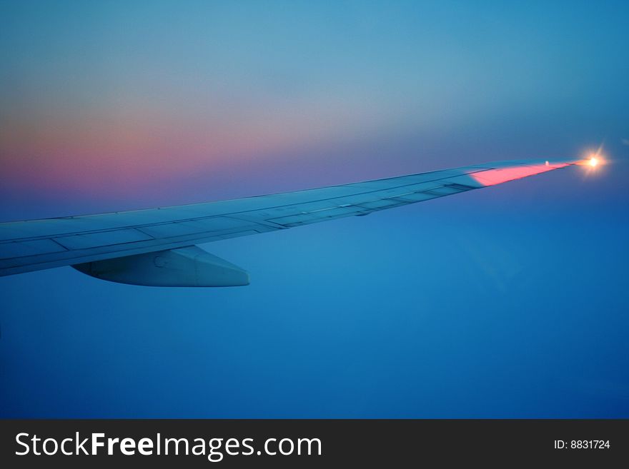 View from the window to the wing and sky. View from the window to the wing and sky