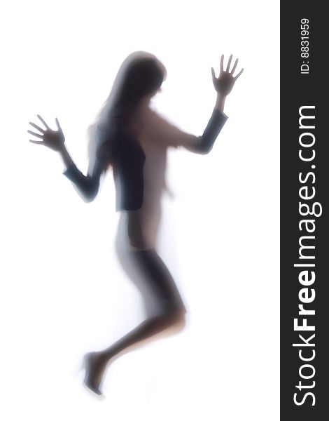 Diffused Silhouette of a womans body threw frosted glass