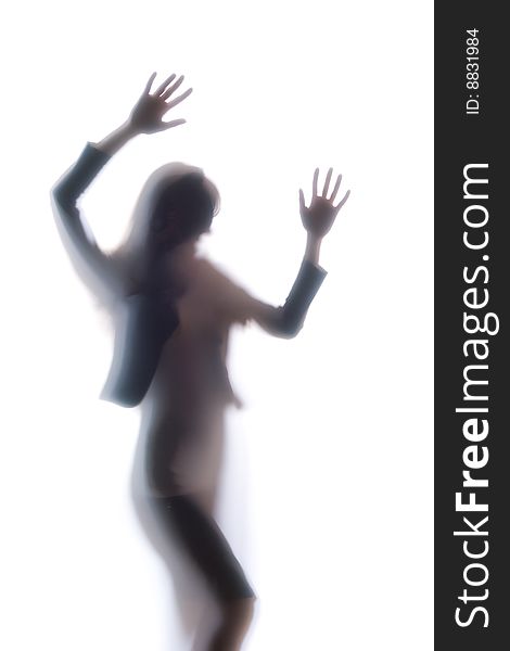 Diffused Silhouette of a womans body threw frosted glass