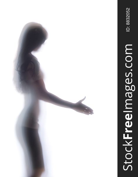 Diffused Silhouette of a womans body threw frosted glass