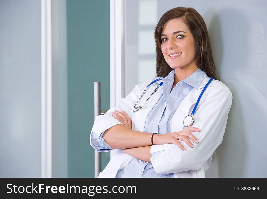 Female doctor arms crossed in a modern office. Female doctor arms crossed in a modern office