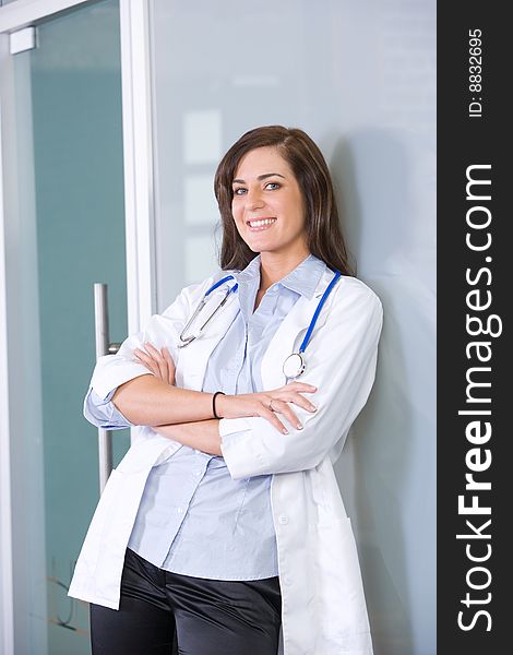 Female doctor arms crossed in a modern office. Female doctor arms crossed in a modern office