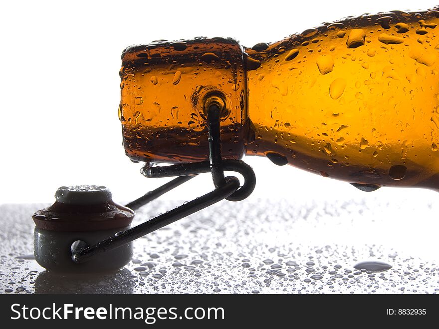Brown Beer Bottle with water drops