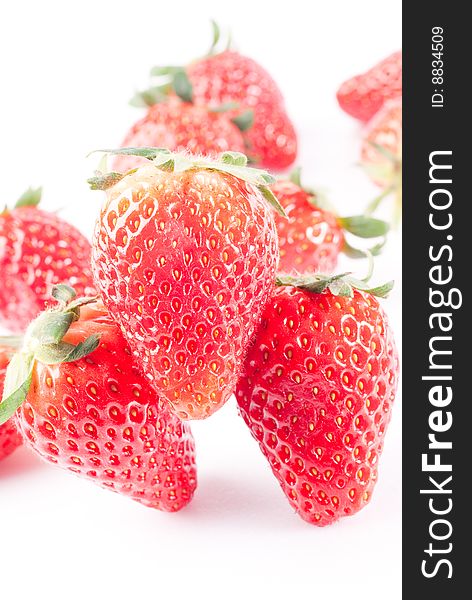 Fresh juicy standing strawberry isolated on white