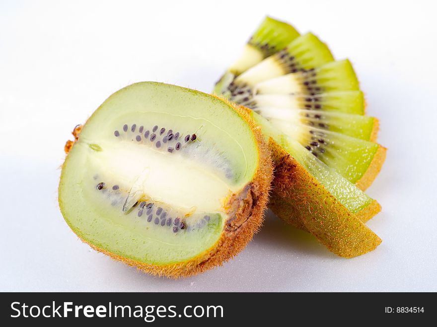 Sliced ripe fresh kiwi isolated on white. Sliced ripe fresh kiwi isolated on white