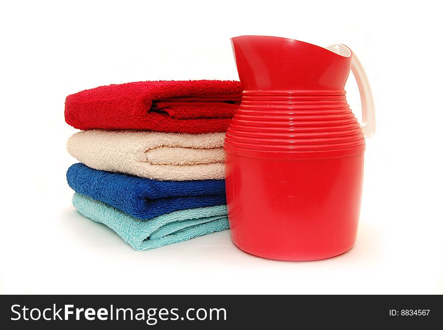 The combined colour towels with a jug on a white background. The combined colour towels with a jug on a white background