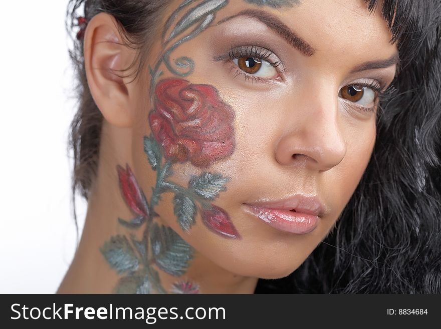 Beauty woman with bodyart on face