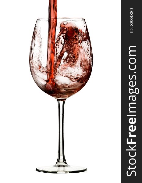 Pouring red wine to glass with white background