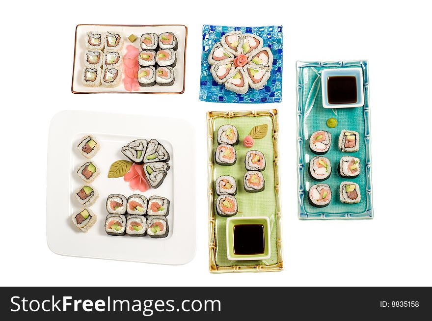 A selection of rolls sushi against a white background