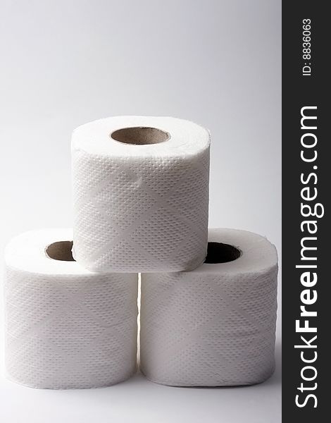 Three rolls toilet paper background