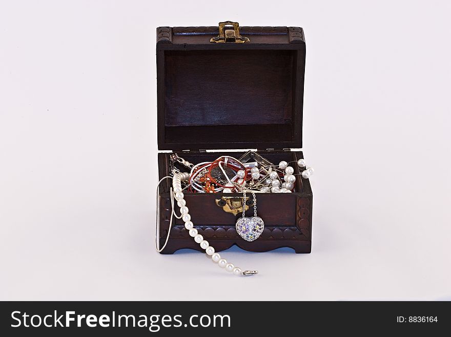 Wooden chest with jewellery, isolated.