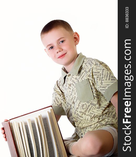 The child with book on the white