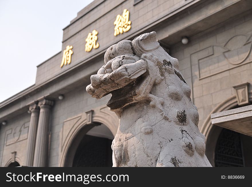 A Stone Lion Statue Before Office Of The President