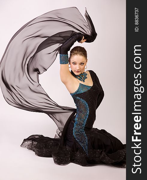 Professional dancer in beautiful dress, studio shot