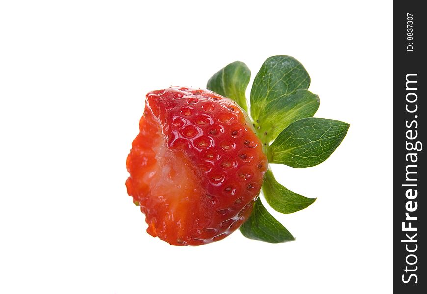 One Organic partially eaten Strawberry isolated on white background. One Organic partially eaten Strawberry isolated on white background.