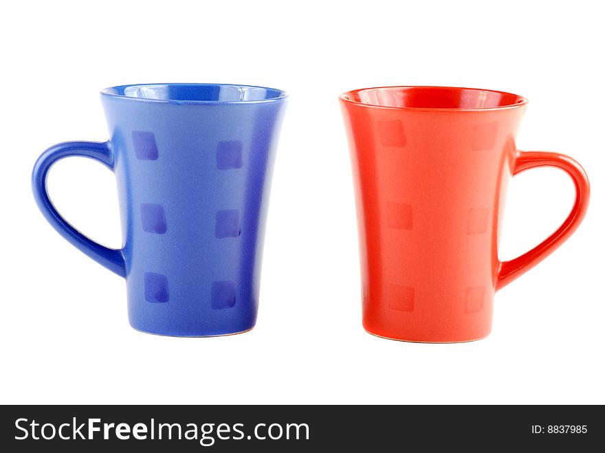 Colour cups for tea and coffee. A small white teapot. Colour cups for tea and coffee. A small white teapot.