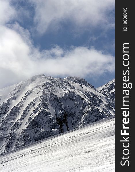 Dino peak in the Bulgarian mountains in March is still snowbound and inhospitable to many tourists come to see it.The photo was made at a height 2400 meters. Dino peak in the Bulgarian mountains in March is still snowbound and inhospitable to many tourists come to see it.The photo was made at a height 2400 meters.