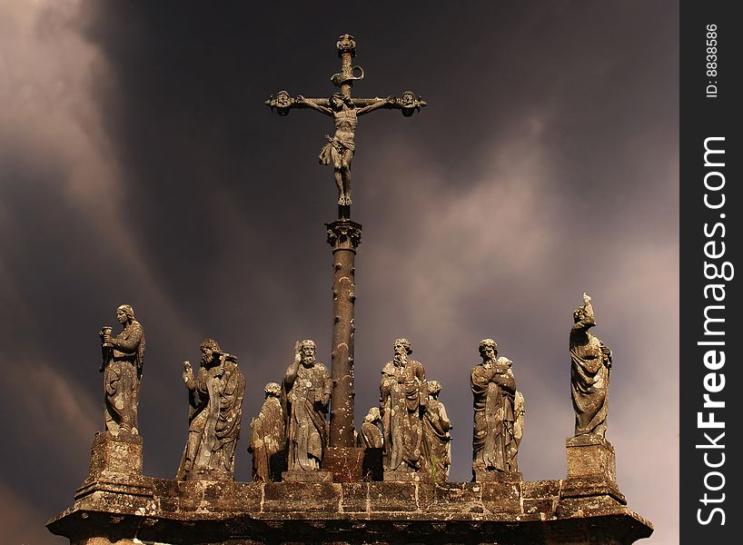 Statues of saints on a background a storm sky