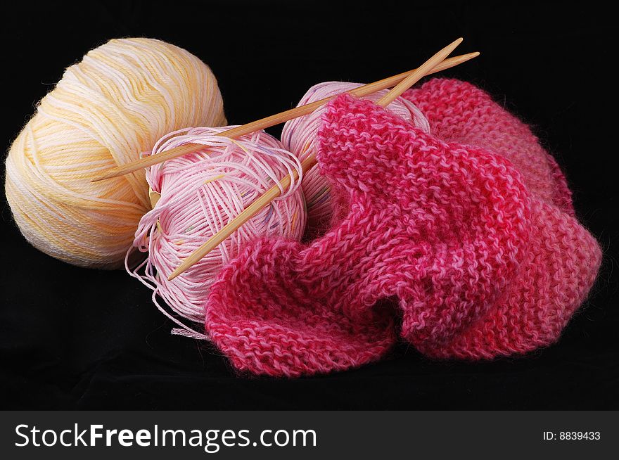 Colorful yarn and needles for knitting. what will you do? a sweater or a neckerchief?. Colorful yarn and needles for knitting. what will you do? a sweater or a neckerchief?