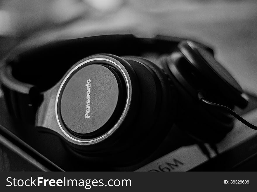 Black and white closeup of modern audio headphones. Black and white closeup of modern audio headphones.