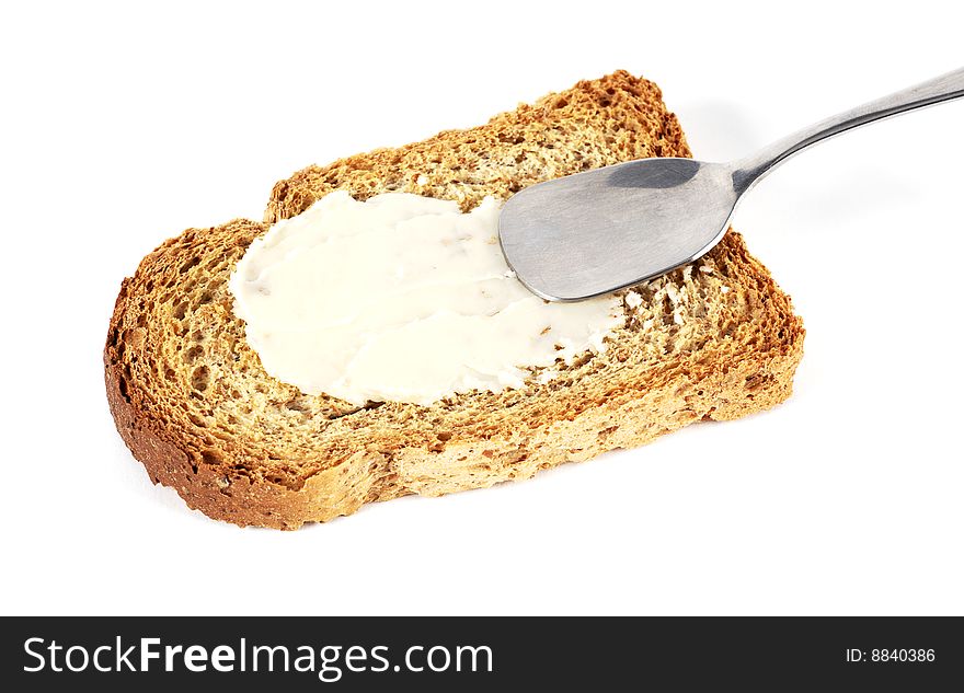 Toast with butter and spoon. Toast with butter and spoon