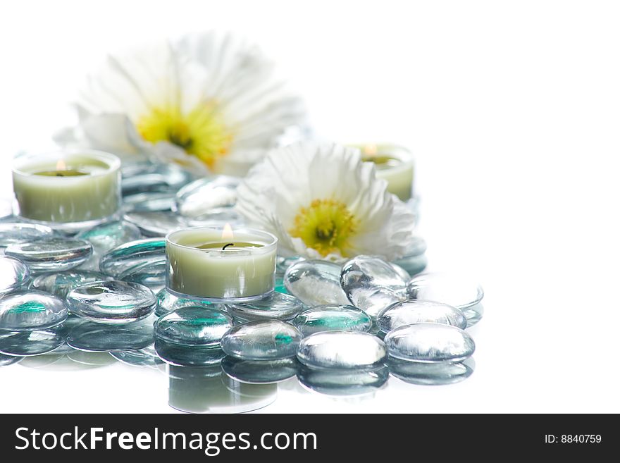 Day Spa with flowers candles in a zen setting isolated on white