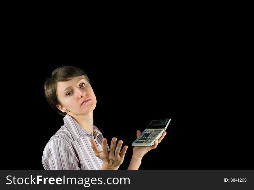 Young business woman with calculator hit by financial crisis on black background. Young business woman with calculator hit by financial crisis on black background